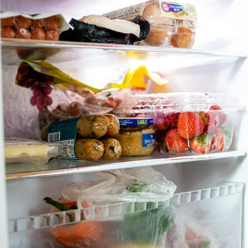 Meal prep containers neatly organised in a fridge