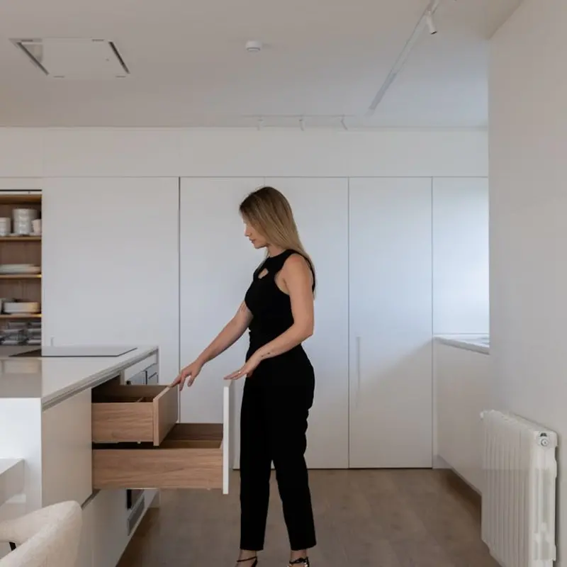 Clean minimalist kitchen counter with organised surfaces